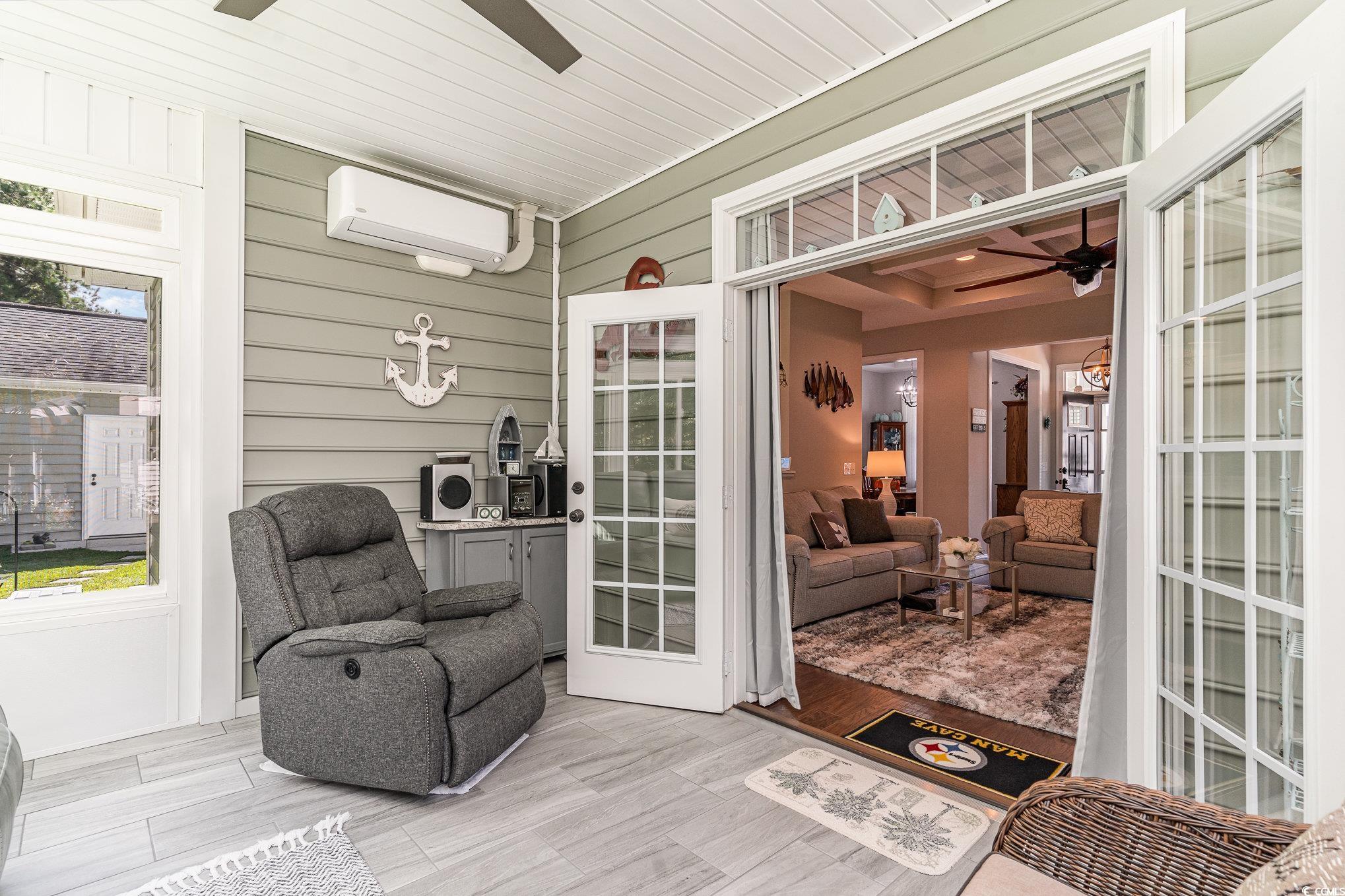 4204 Ridgewood Drive Conway, SC 29526 - Photo 26 of 38 Sunroom featuring an AC wall unit and wooden ceili