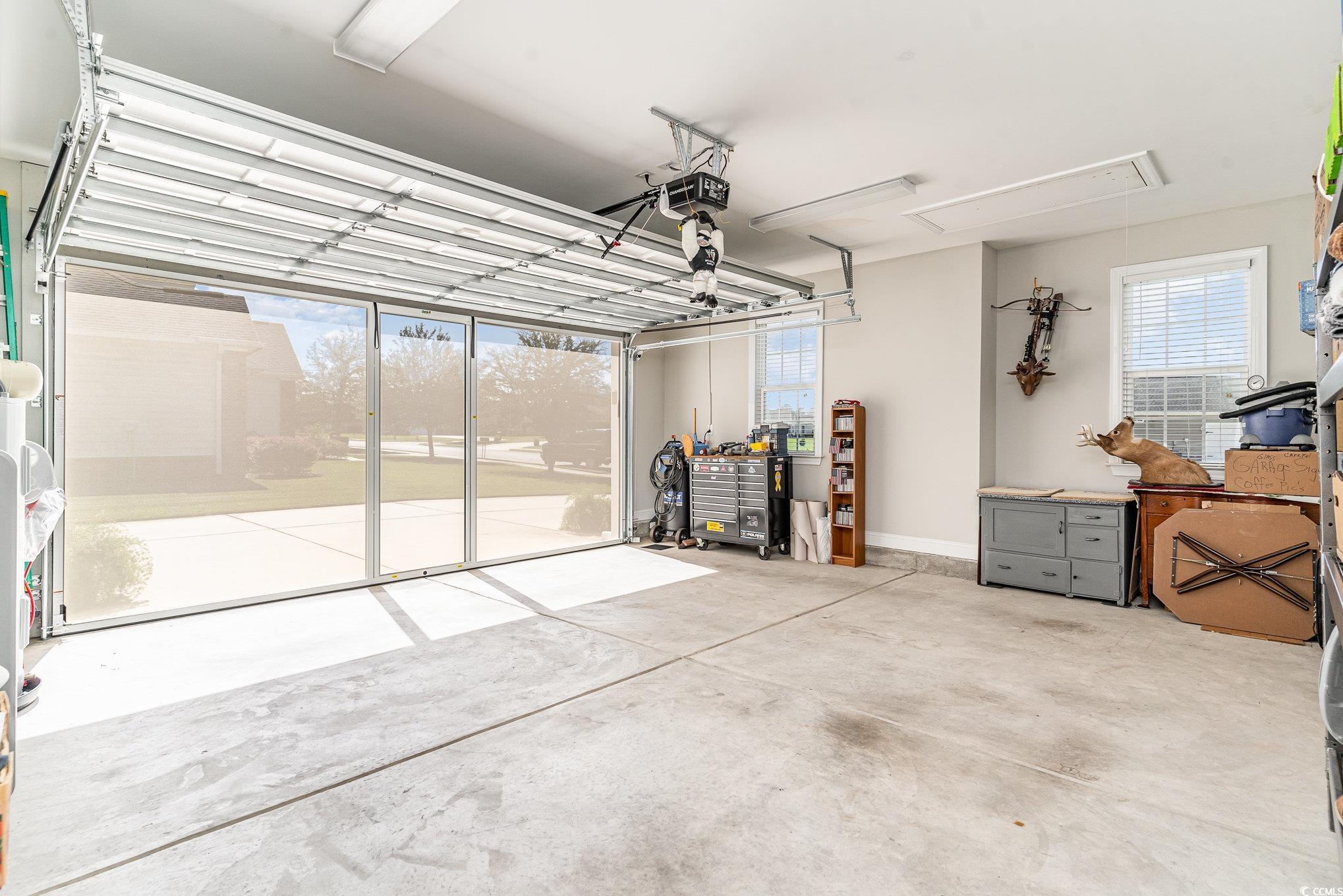 4204 Ridgewood Drive Conway, SC 29526 - Photo 28 of 38 Garage featuring a garage door opener