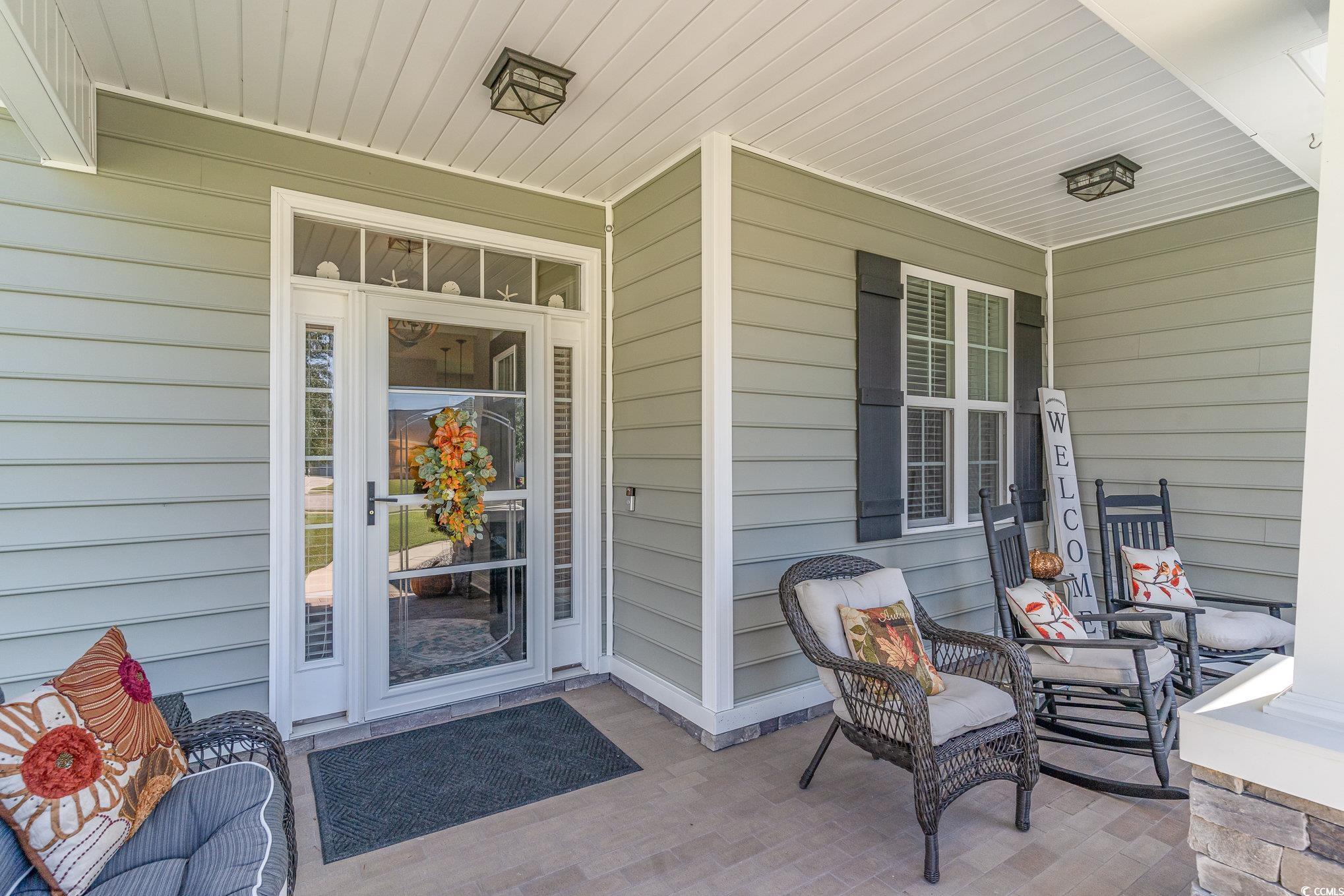 Entrance to property featuring a porch