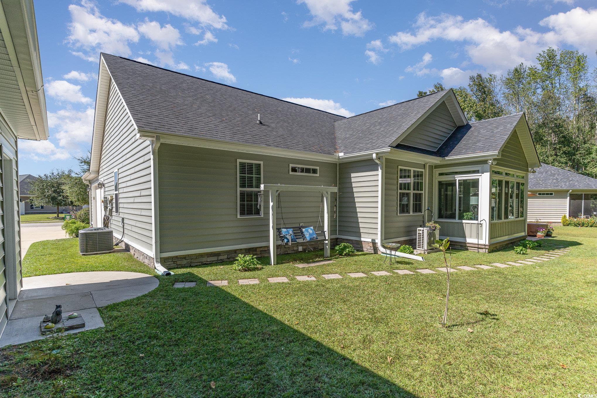 4204 Ridgewood Drive Conway, SC 29526 - Photo 31 of 38 Back of house featuring central AC unit, a sunroom