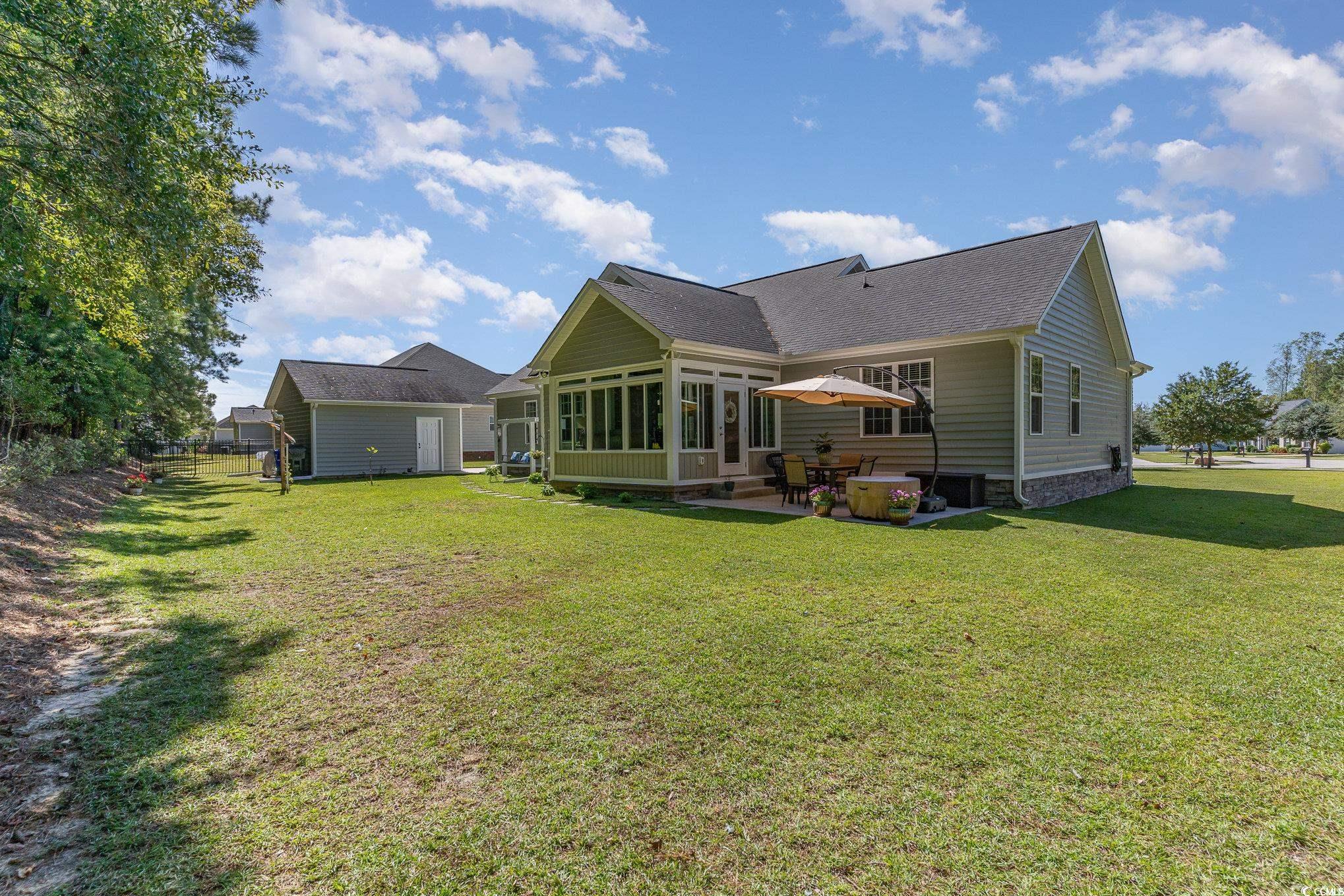 4204 Ridgewood Drive Conway, SC 29526 - Photo 33 of 38 Back of house with a yard, a sunroom, and a patio