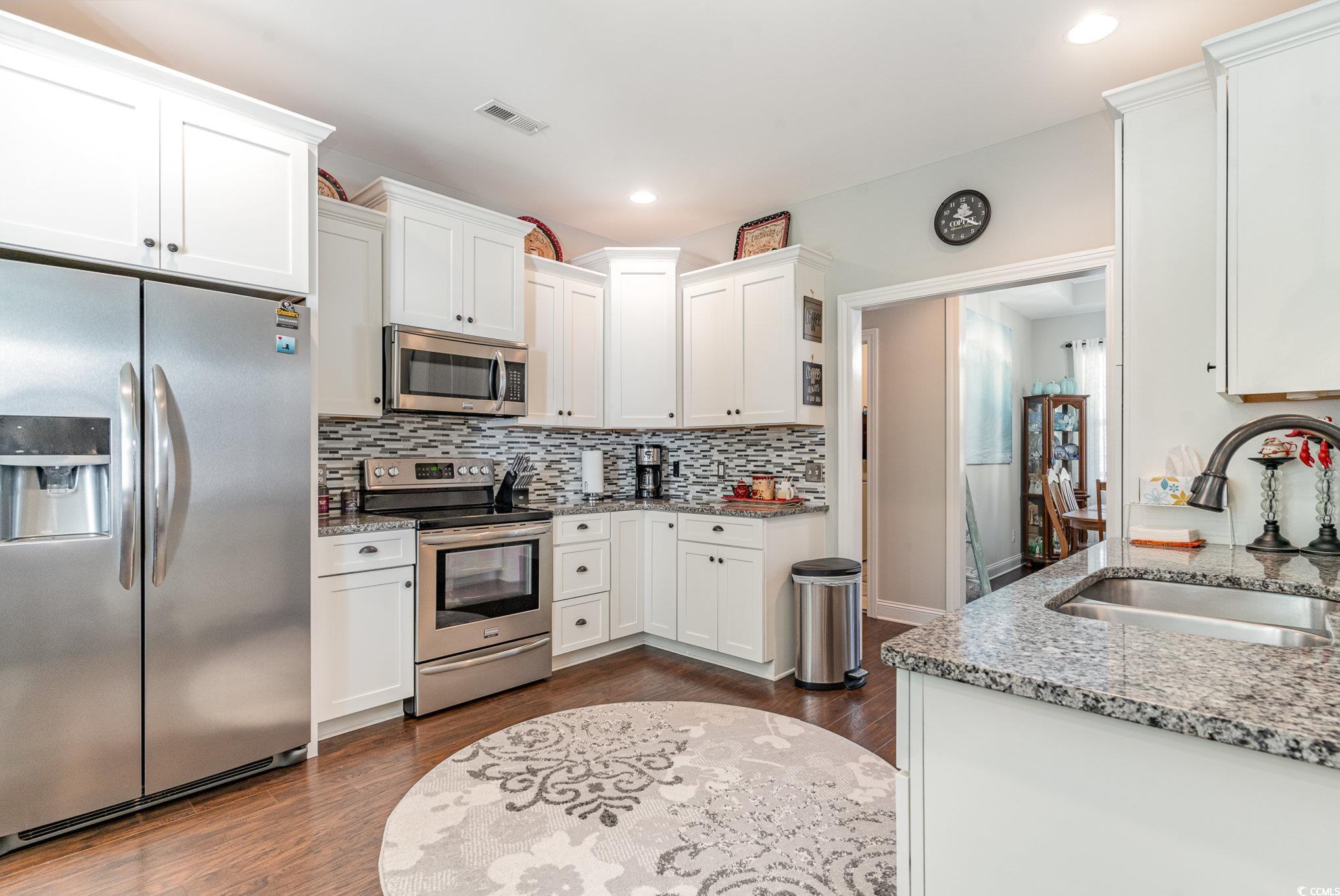 Kitchen featuring appliances with stainless steel