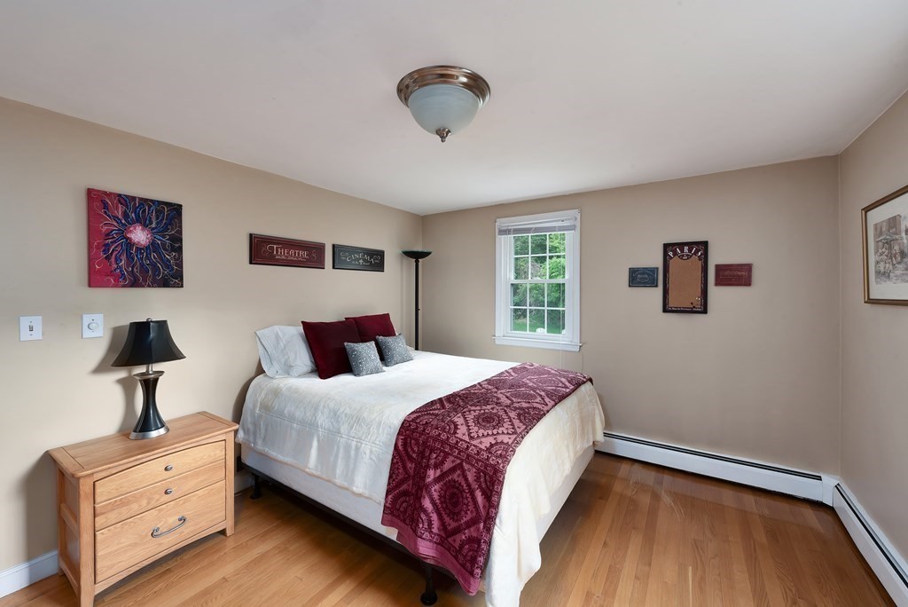 6 Trask Road Boxford, MA 01921 - Photo 15 of 36 a bedroom with a bed and a lamp on dresser