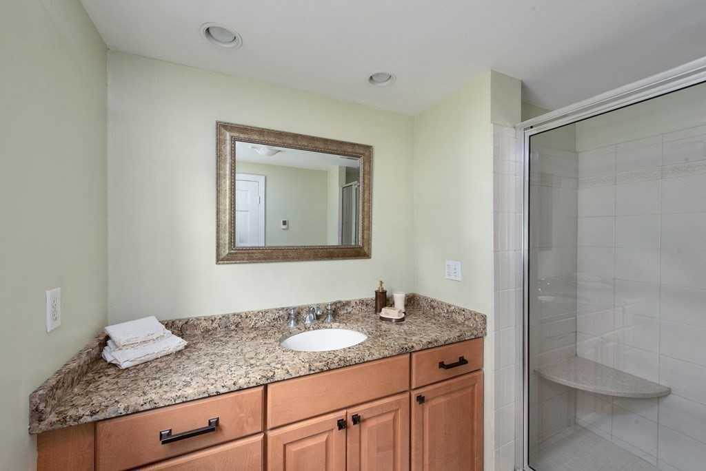 6 Trask Road Boxford, MA 01921 - Photo 19 of 36 a bathroom with a granite countertop sink and a mirror