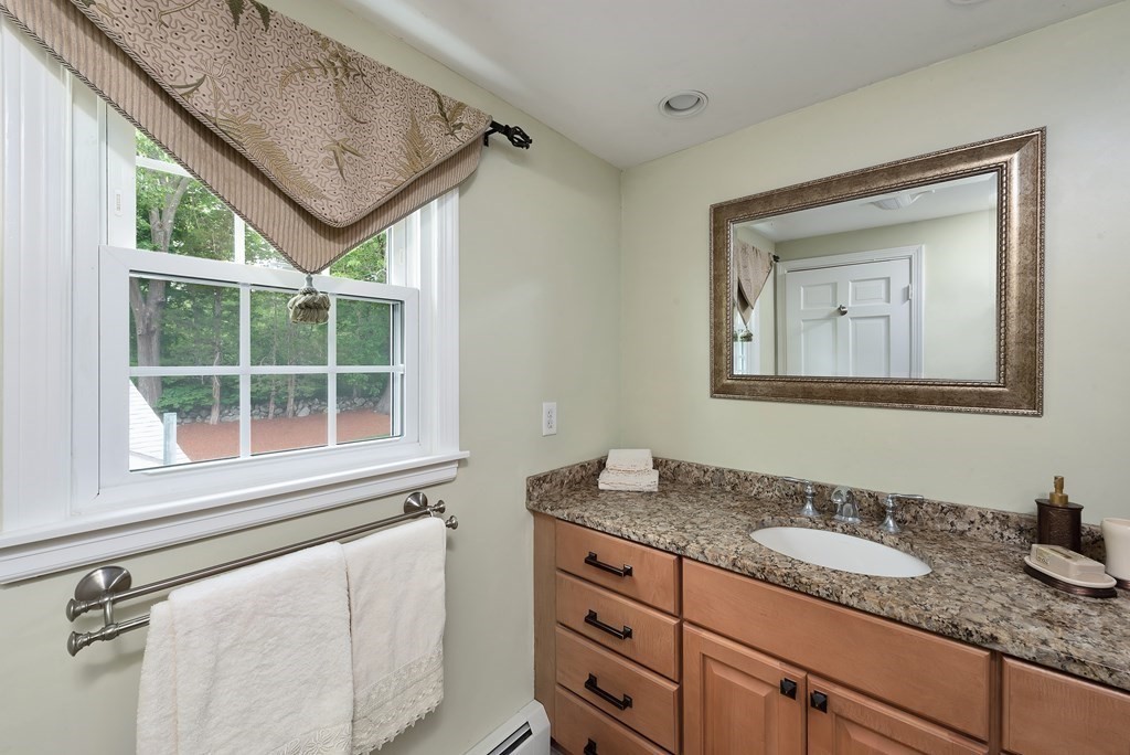 6 Trask Road Boxford, MA 01921 - Photo 20 of 36 a bathroom with a granite countertop sink mirror vanity and window