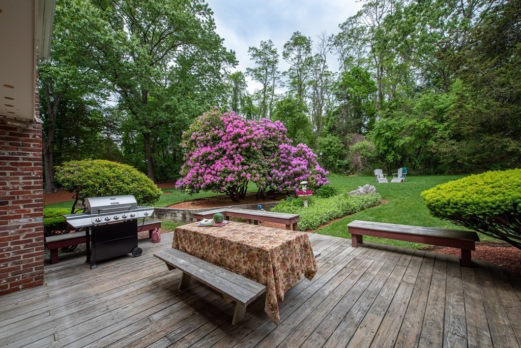 6 Trask Road Boxford, MA 01921 - Photo 26 of 36 a view of a wooden bench with chairs in front of house