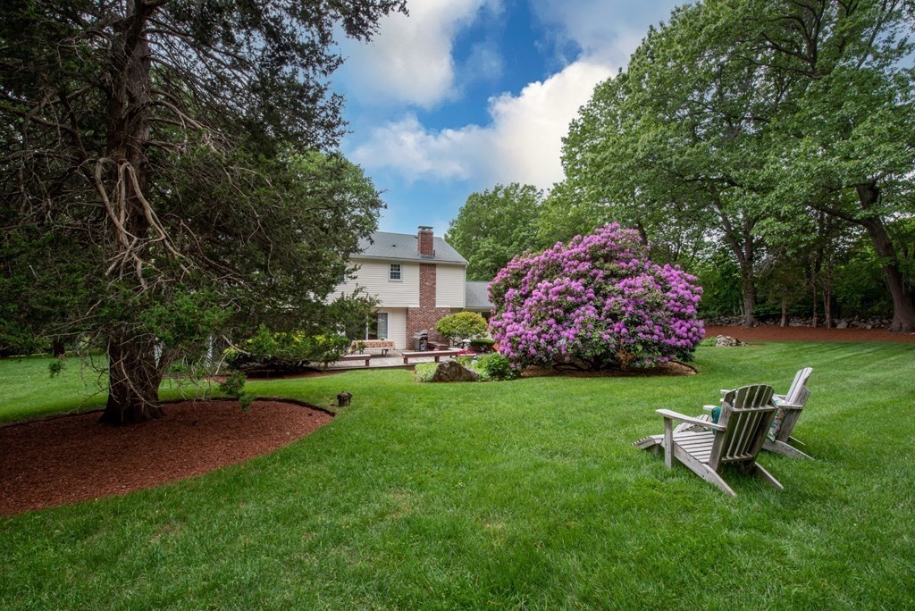 6 Trask Road Boxford, MA 01921 - Photo 29 of 36 a garden with a bench and some trees