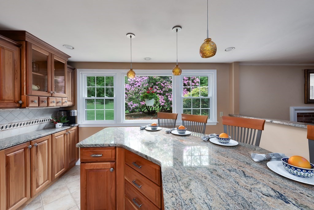 6 Trask Road Boxford, MA 01921 - Photo 3 of 36 a kitchen with a sink a stove and a wooden cabinets