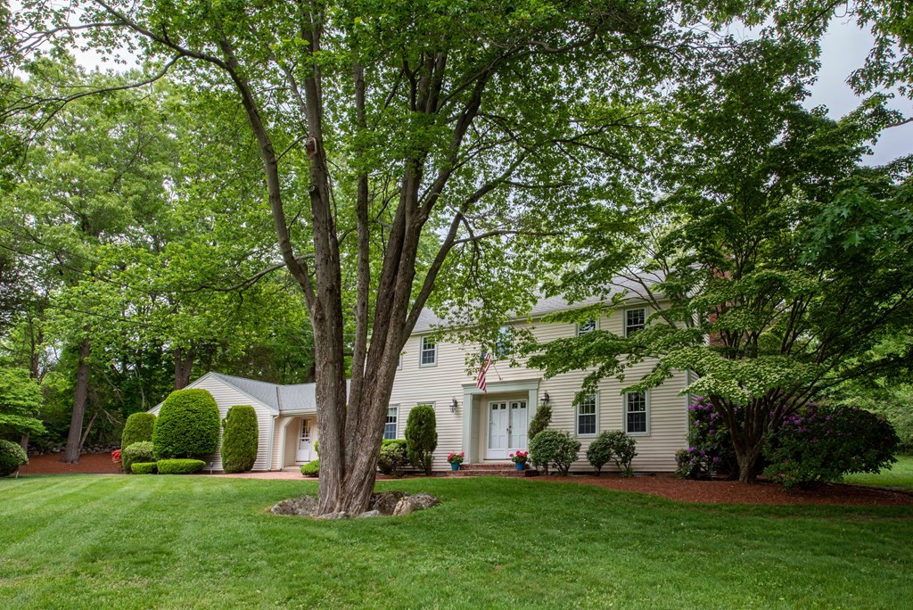6 Trask Road Boxford, MA 01921 - Photo 32 of 36 a front view of a house with a garden and trees