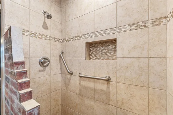 a kitchen with stainless steel appliances granite countertop a stove a refrigerator and a microwave