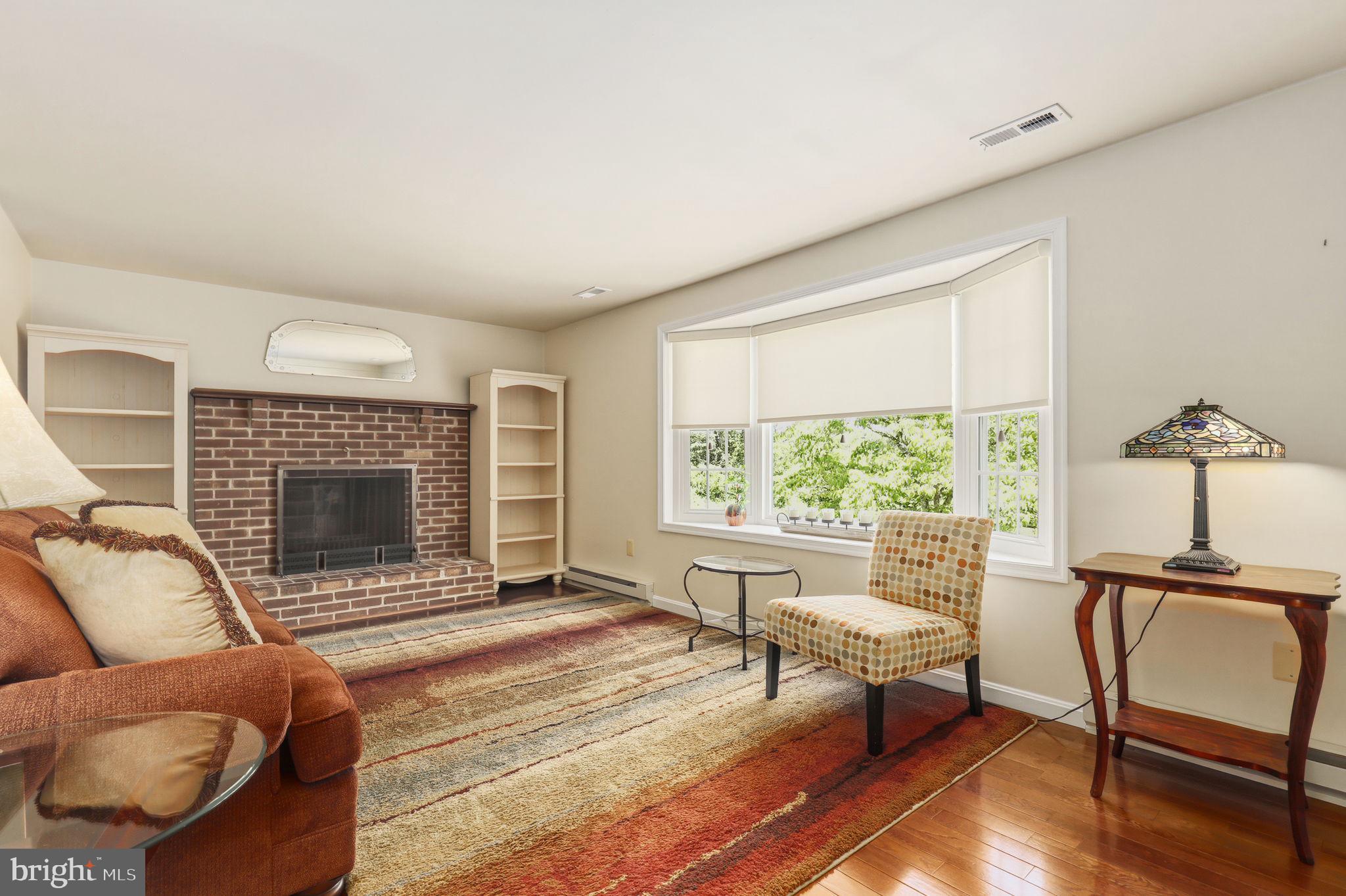 6336 Boyers Mill Road New Market, MD 21774 - Photo 13 of 49 a living room with furniture a window and a fireplace