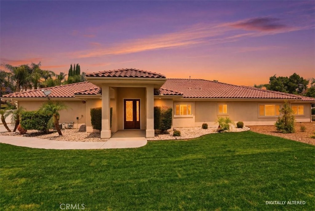 a view of a house with backyard sitting area and garden