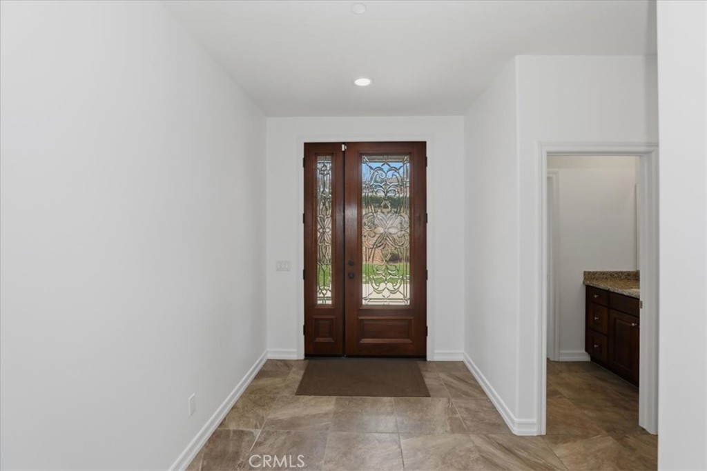 14202 Meadowlands Drive Riverside, CA 92503 - Photo 11 of 60 an empty room with windows and closet