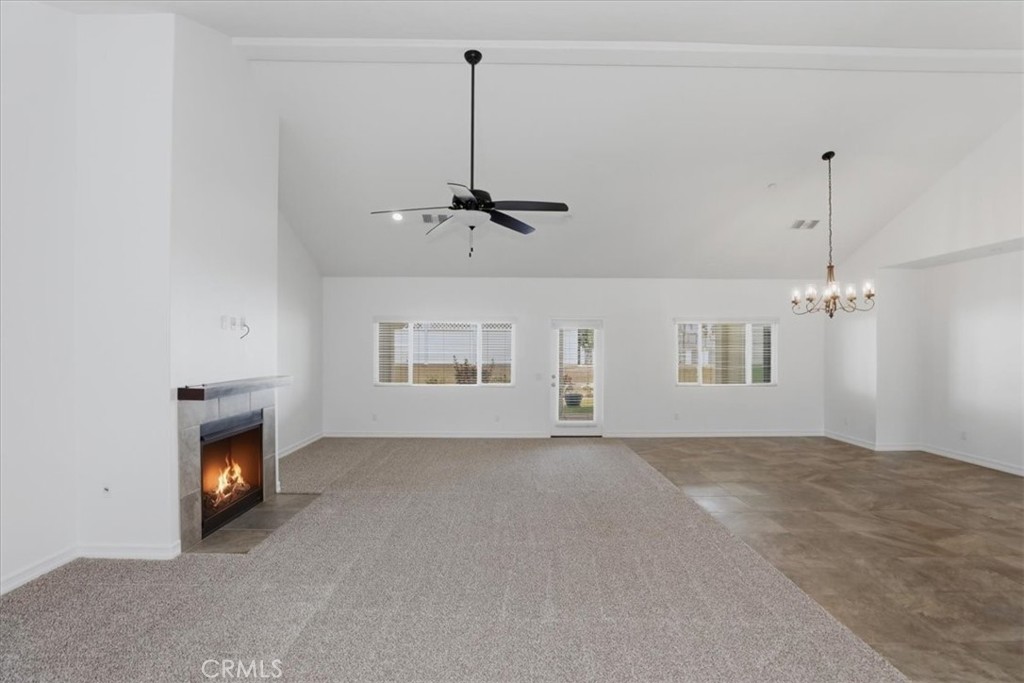 14202 Meadowlands Drive Riverside, CA 92503 - Photo 12 of 60 a view of an empty room with a fireplace and a window