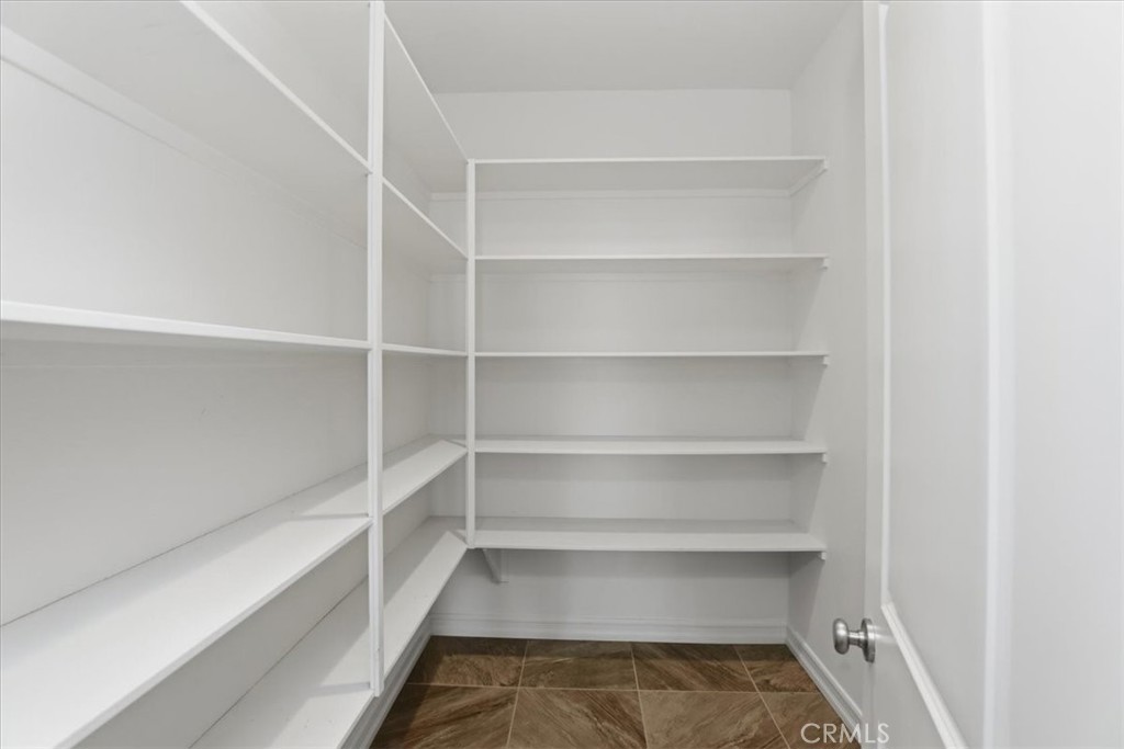 14202 Meadowlands Drive Riverside, CA 92503 - Photo 20 of 60 a view of walk in closet with empty racks