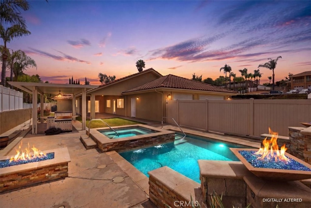 14202 Meadowlands Drive Riverside, CA 92503 - Photo 2 of 60 a roof deck with table and chairs and potted plants