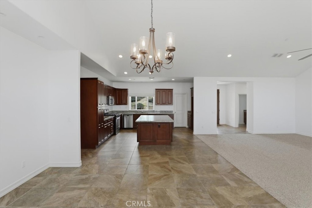 14202 Meadowlands Drive Riverside, CA 92503 - Photo 21 of 60 a view of a livingroom with a chandelier furniture and windows