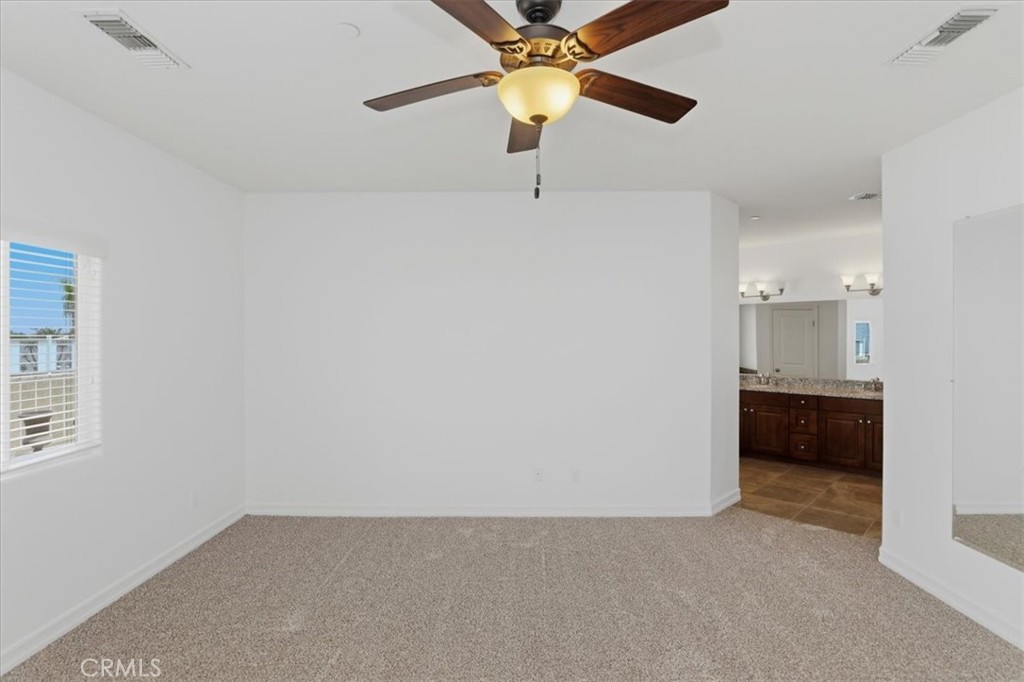 14202 Meadowlands Drive Riverside, CA 92503 - Photo 25 of 60 a view of a room with a ceiling fan