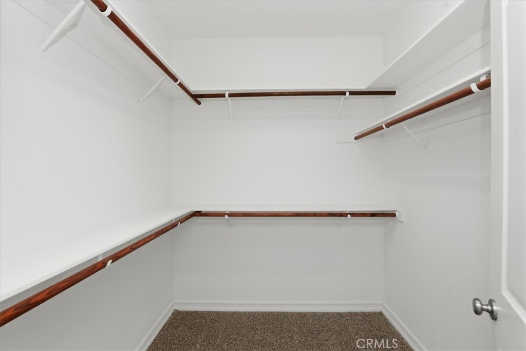 14202 Meadowlands Drive Riverside, CA 92503 - Photo 35 of 60 a view of a room with racks on the wall