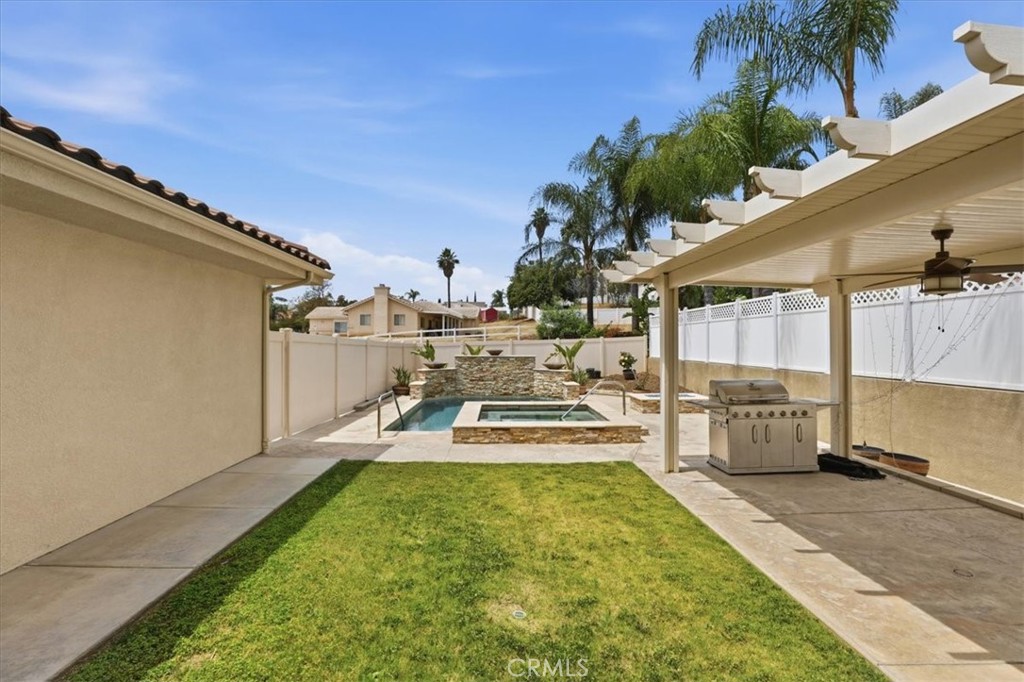 14202 Meadowlands Drive Riverside, CA 92503 - Photo 41 of 60 a view of a swimming pool with a patio