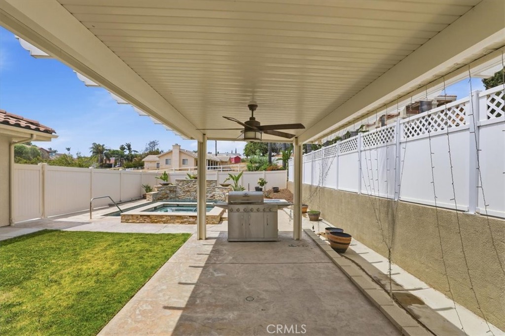 14202 Meadowlands Drive Riverside, CA 92503 - Photo 42 of 60 a view of a swimming pool with a patio