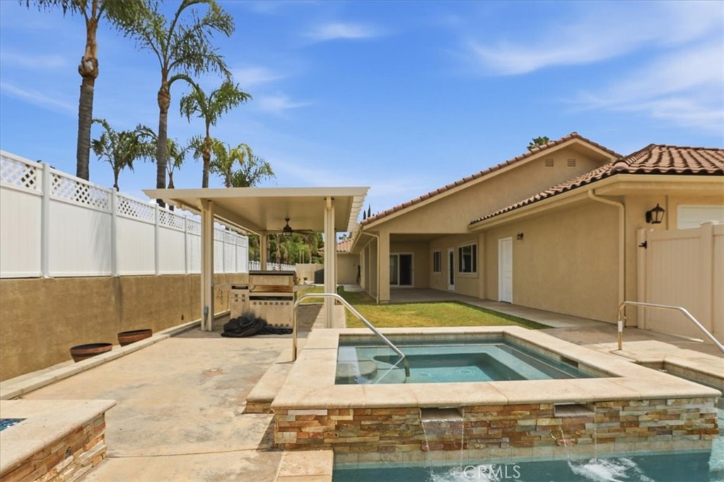 14202 Meadowlands Drive Riverside, CA 92503 - Photo 46 of 60 a view of a house with swimming pool and sitting area