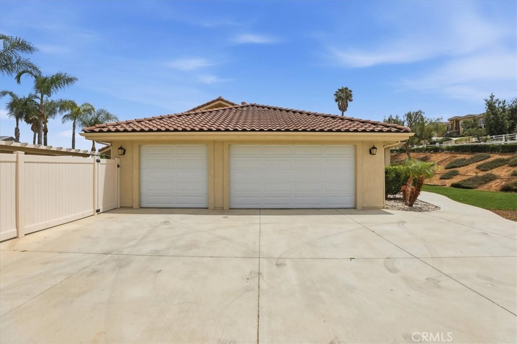 14202 Meadowlands Drive Riverside, CA 92503 - Photo 50 of 60 a view of a house with a yard and garage