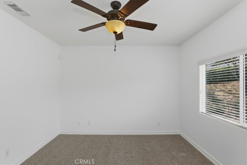 14202 Meadowlands Drive Riverside, CA 92503 - Photo 58 of 60 a view of an empty room with a window