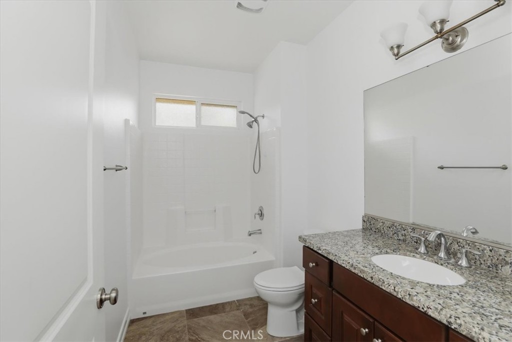 14202 Meadowlands Drive Riverside, CA 92503 - Photo 60 of 60 a bathroom with a granite countertop sink toilet and shower