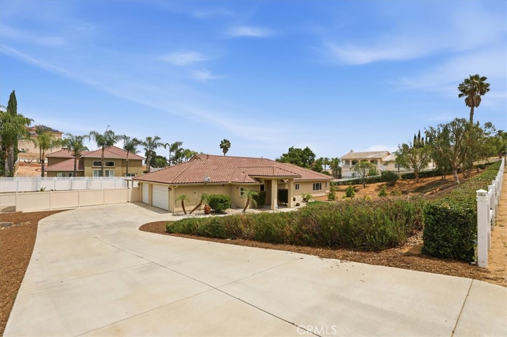 14202 Meadowlands Drive Riverside, CA 92503 - Photo 7 of 60 a front view of a house with a yard