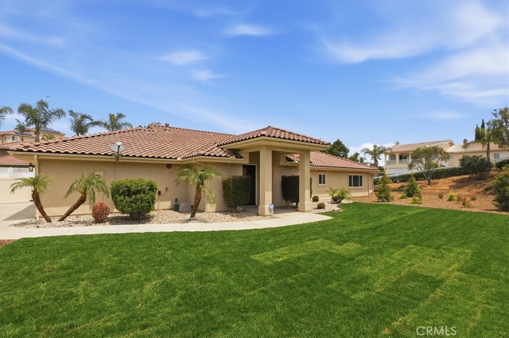 14202 Meadowlands Drive Riverside, CA 92503 - Photo 9 of 60 a front view of a house with garden