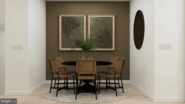 a dining room with furniture and wooden floor