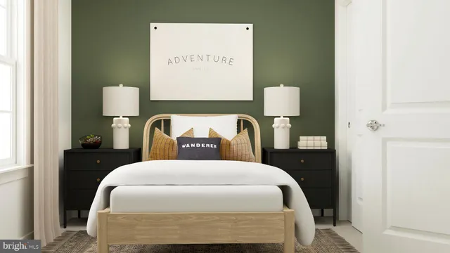 a bedroom with a bed and a lamp on table