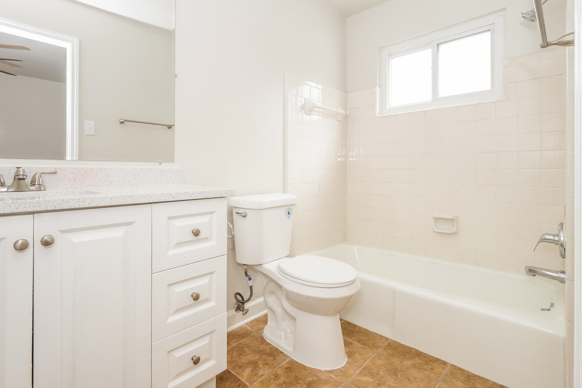 207 East Pecan Valley Street Collierville, TN 38017 - Photo 5 of 18 Bathroom with bathing tub / shower combination, vanity, and light tile patterned floors