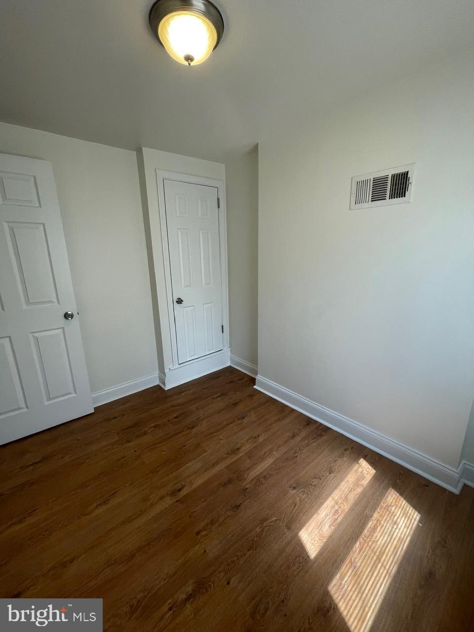 109 Carver Road Dundalk, MD 21222 - Photo 16 of 23 a view of an empty room and window