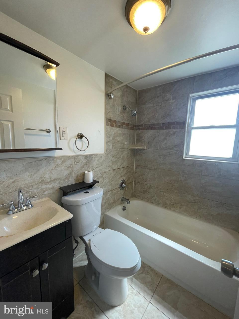 109 Carver Road Dundalk, MD 21222 - Photo 17 of 23 a bathroom with a sink toilet and shower