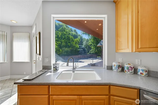 a kitchen with wooden floors and a stove
