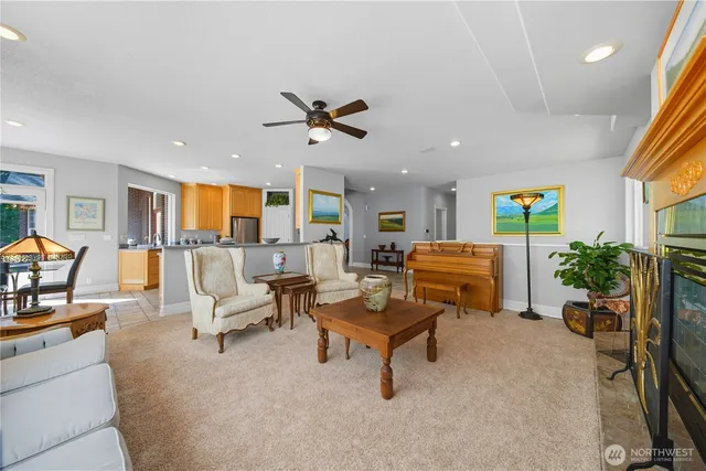 a living room with furniture a dining table and wooden floor