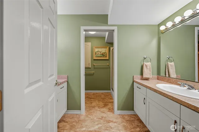 a spacious bedroom with a bed and window