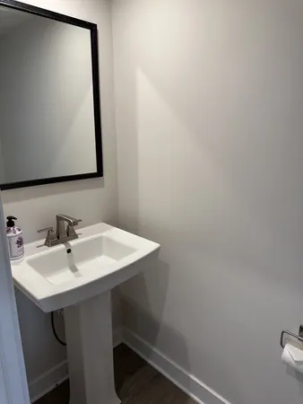a bathroom with a sink and mirror