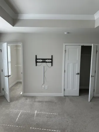 a bathroom with a sink shower and a mirror