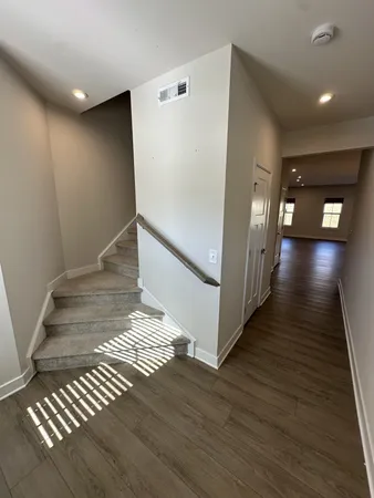 a view of entryway with wooden floor