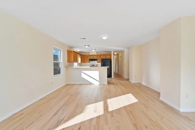 a view of kitchen with wooden floor