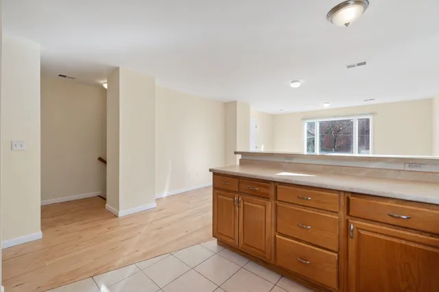 a room with a wooden floor and entryway