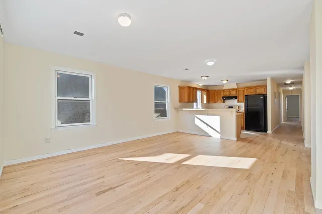 a view of kitchen with wooden floor