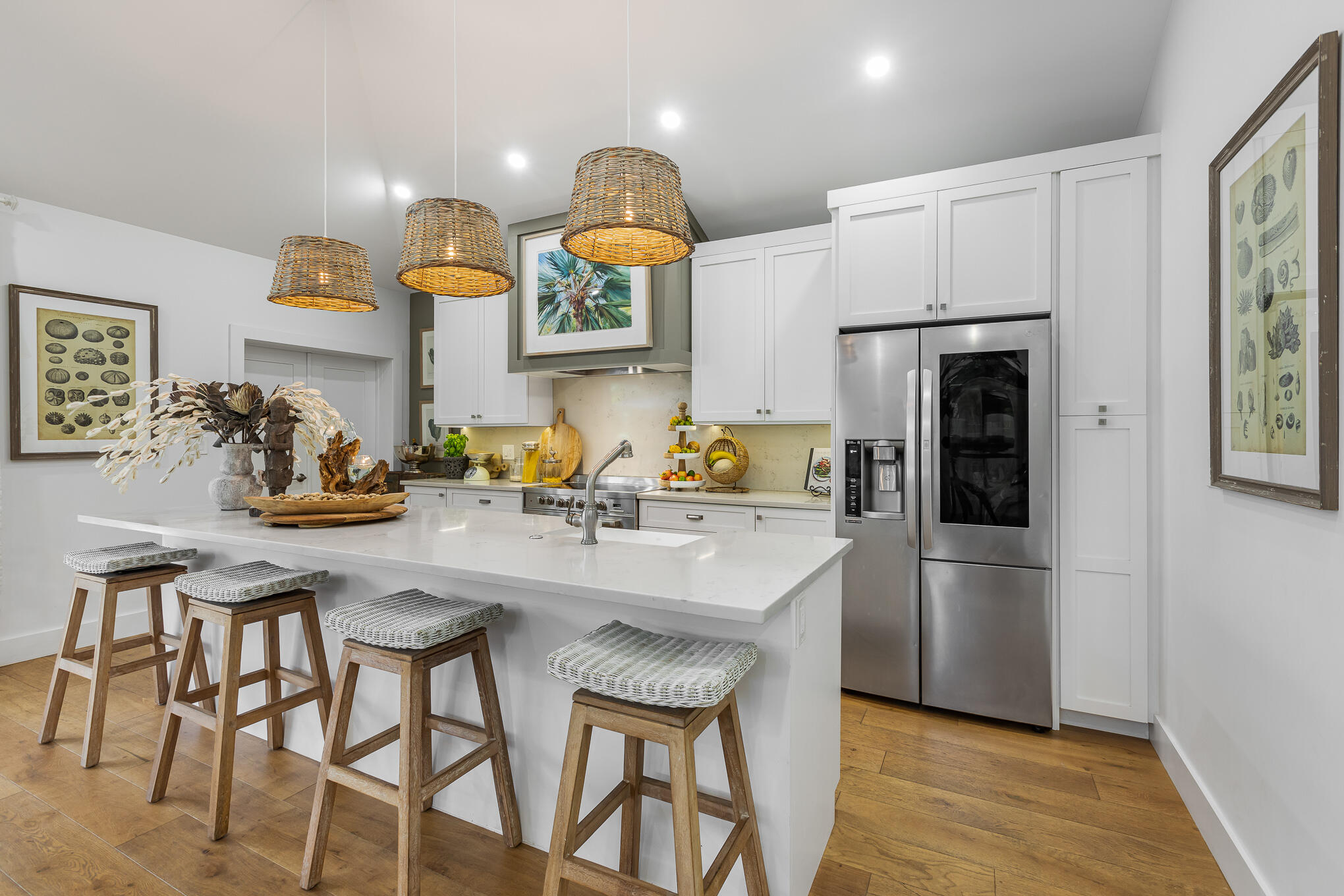 916 Seminary Street Key West, FL 33040 - Photo 14 of 37 a kitchen with stainless steel appliances granite countertop a stove a refrigerator and a dining table with wooden floor