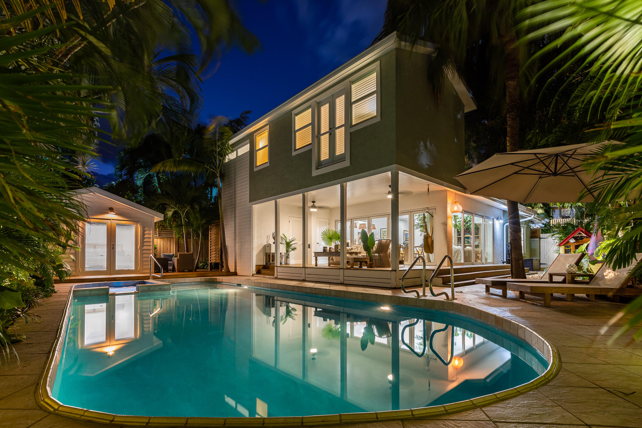 916 Seminary Street Key West, FL 33040 - Photo 2 of 37 a swimming pool with outdoor seating and yard