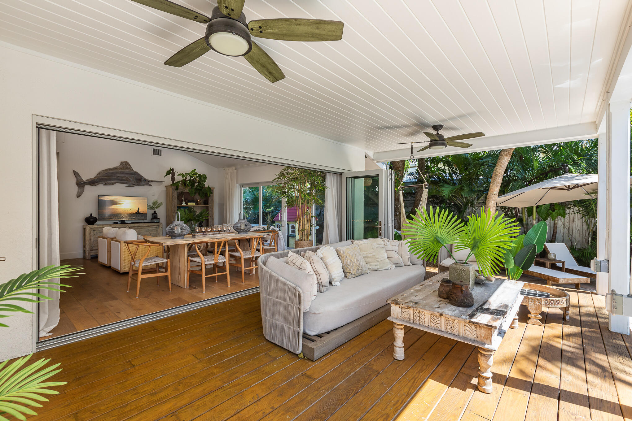 916 Seminary Street Key West, FL 33040 - Photo 28 of 37 a living room with furniture a rug potted plant and a large window