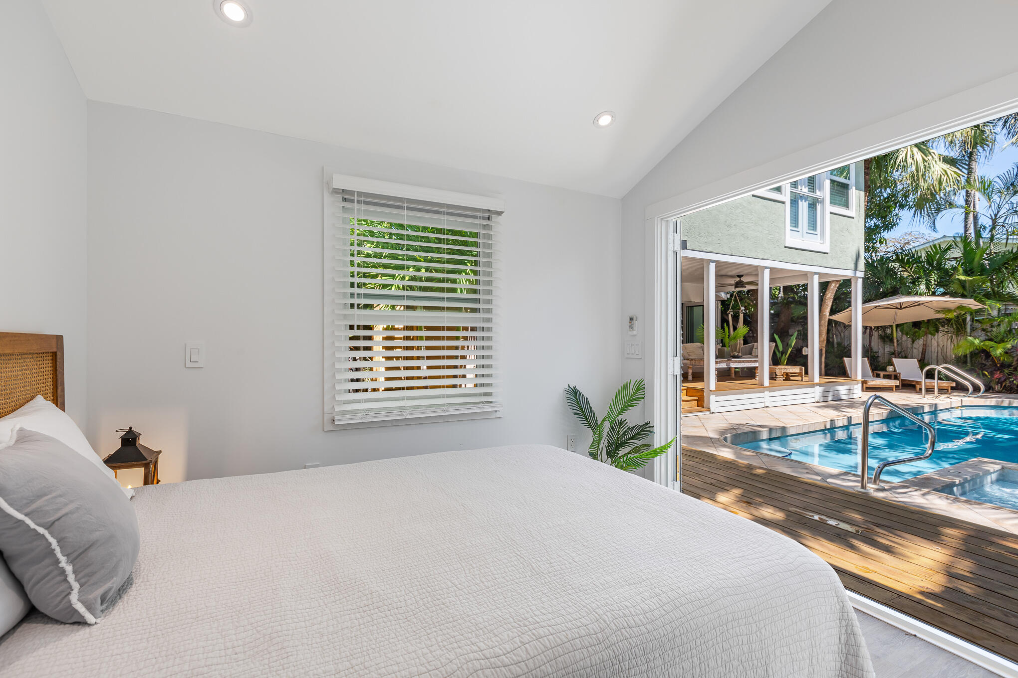 916 Seminary Street Key West, FL 33040 - Photo 35 of 37 a bedroom with a bed and a large window