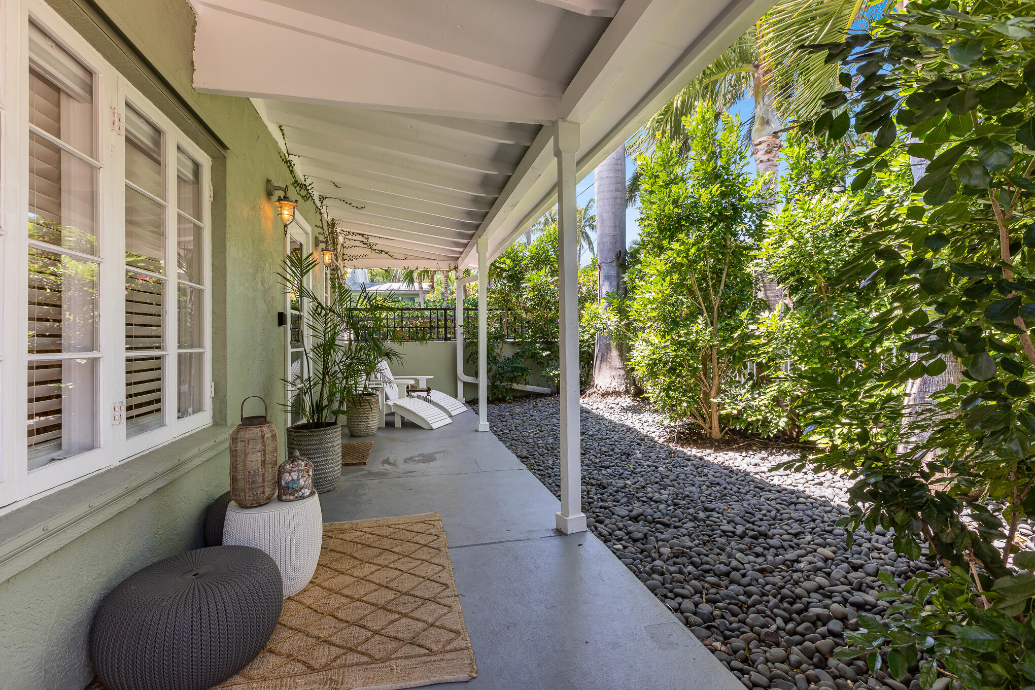 916 Seminary Street Key West, FL 33040 - Photo 4 of 37 a view of a porch with furniture and a yard